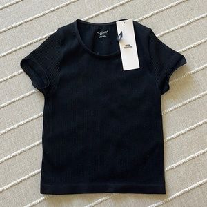 Cropped tight black crop top from urban outfitters.